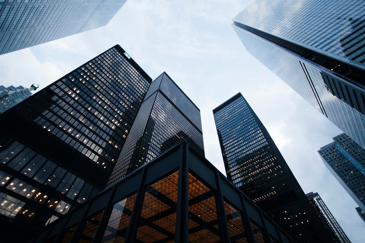 Looking up at modern skyscrapers, Christian businesses building something that lasts.